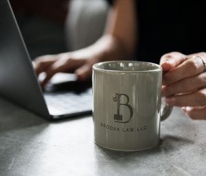 Brodak Law mug in an office